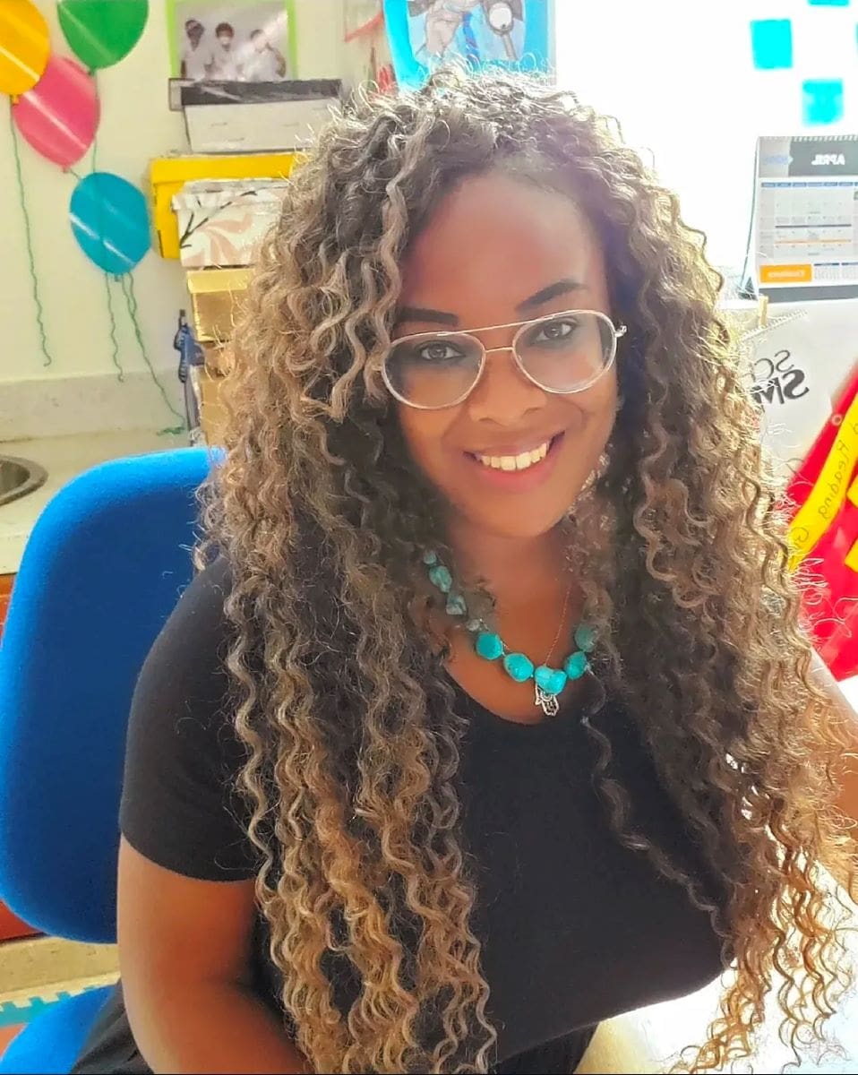 Anjalee Beverly sitting in a classroom