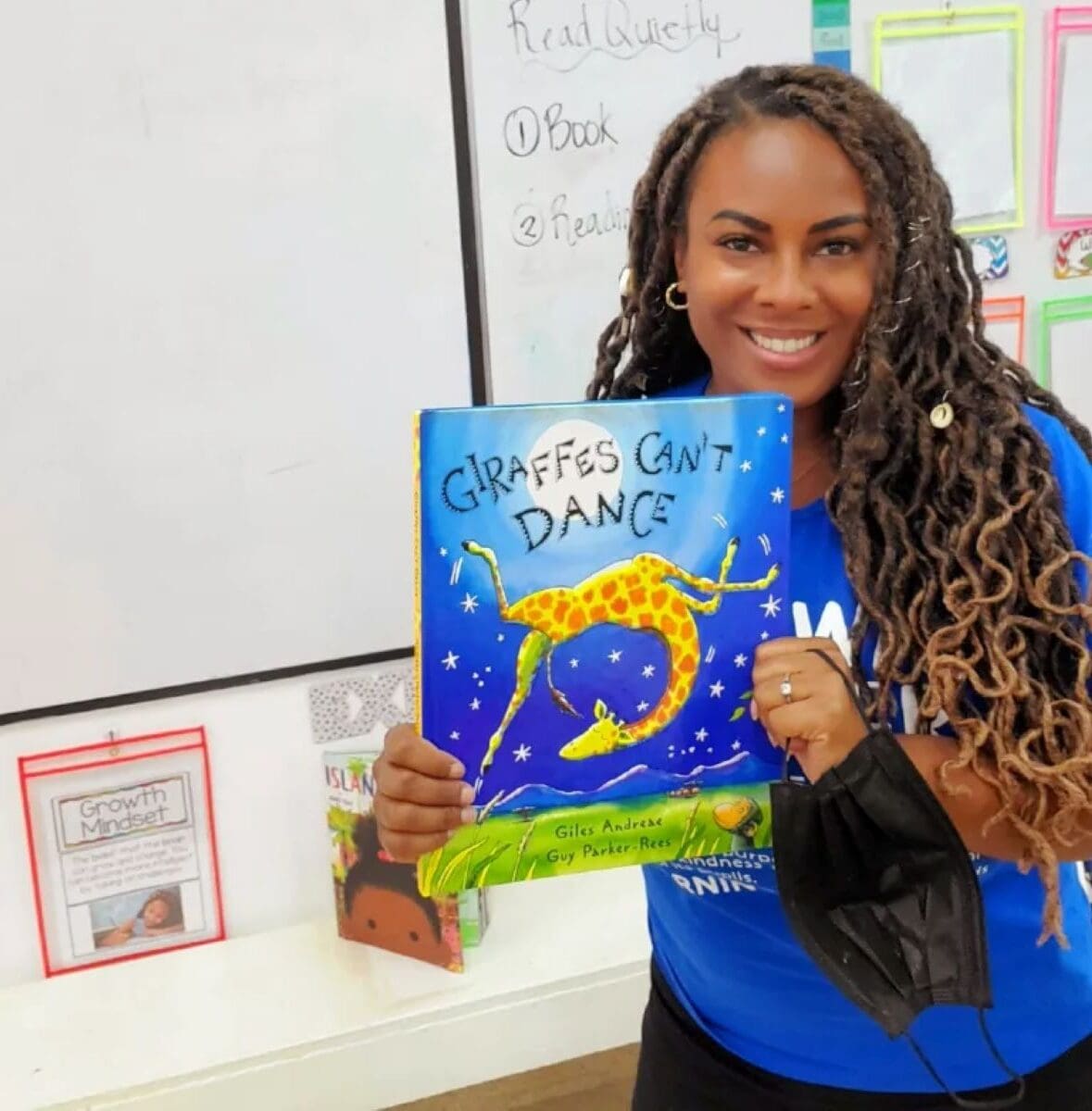 Anjalee holding Giraffes Can't Dance book